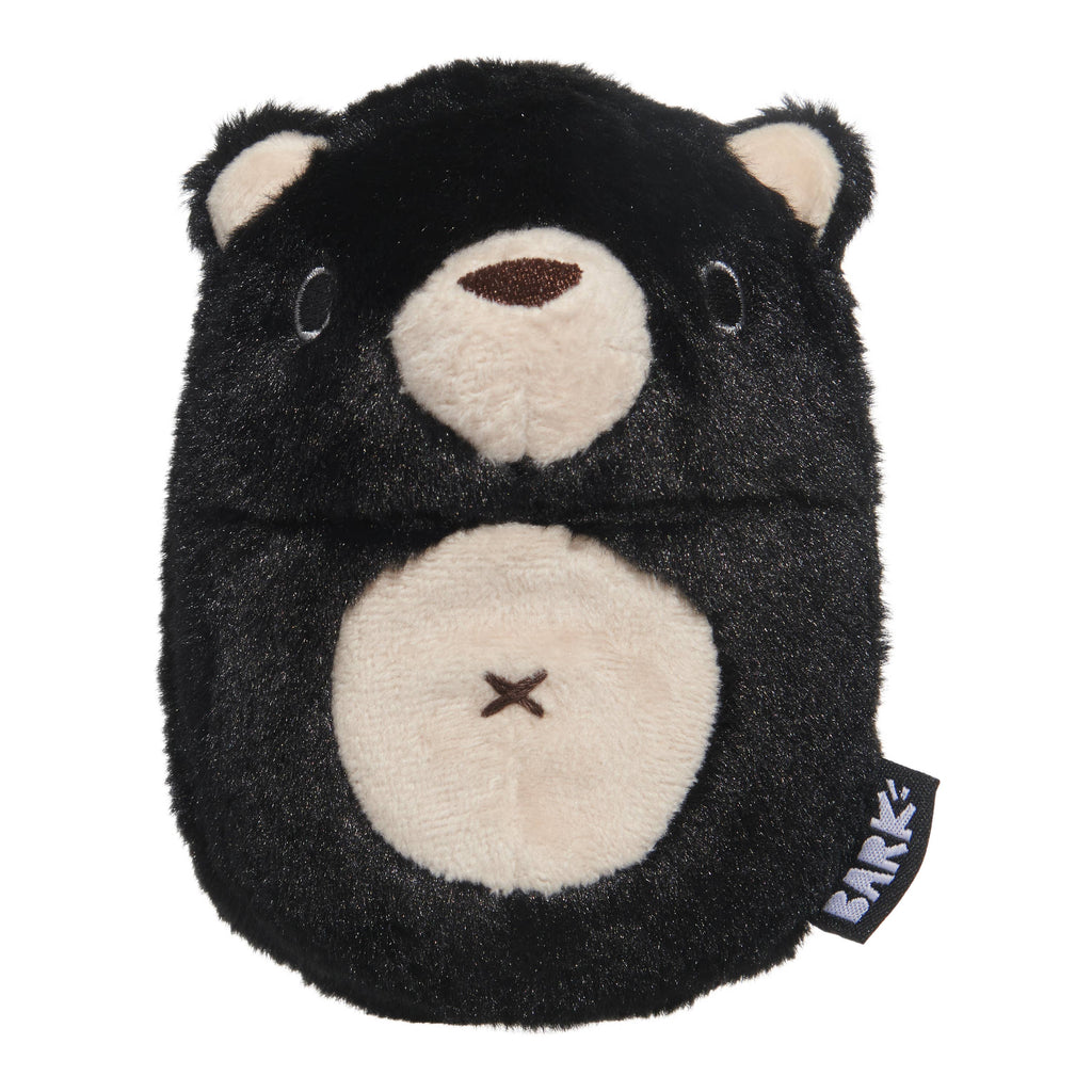 BARK Black Bear Bones dog toy with a rounded black furry body, cream muzzle, inner ears, and belly, and an embroidered brown nose.
