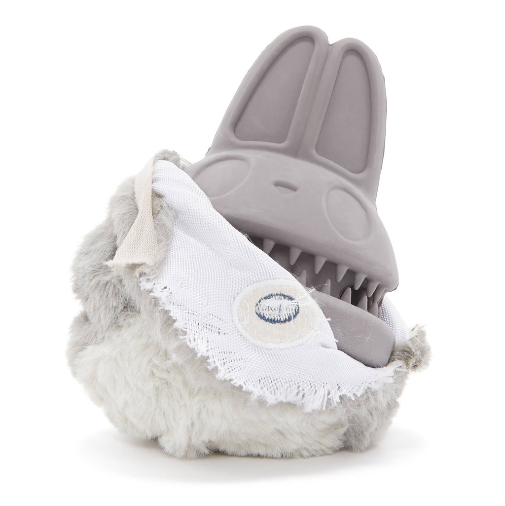 Gray BARK Hare Raiser rabbit dog toy with upright rubber ears, blue embroidered eyes, a fluffy white belly, and a rounded body.